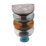 4 cups of different colors in glass