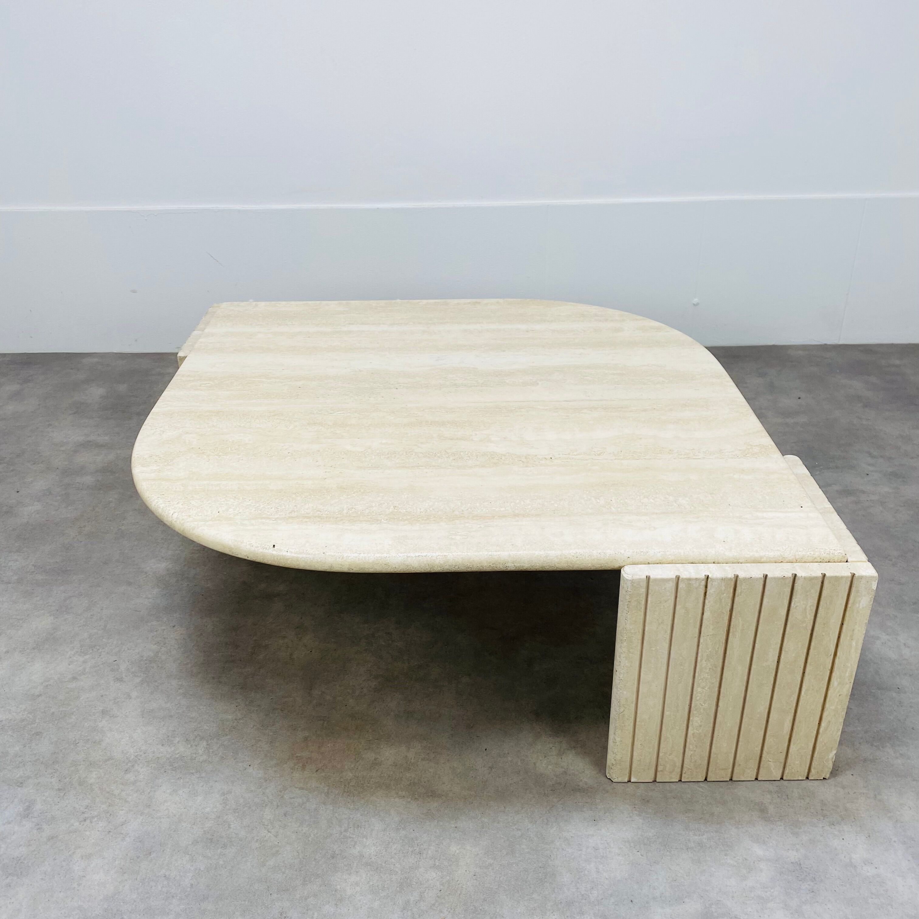 Travertine eye coffee table Roche Bobois