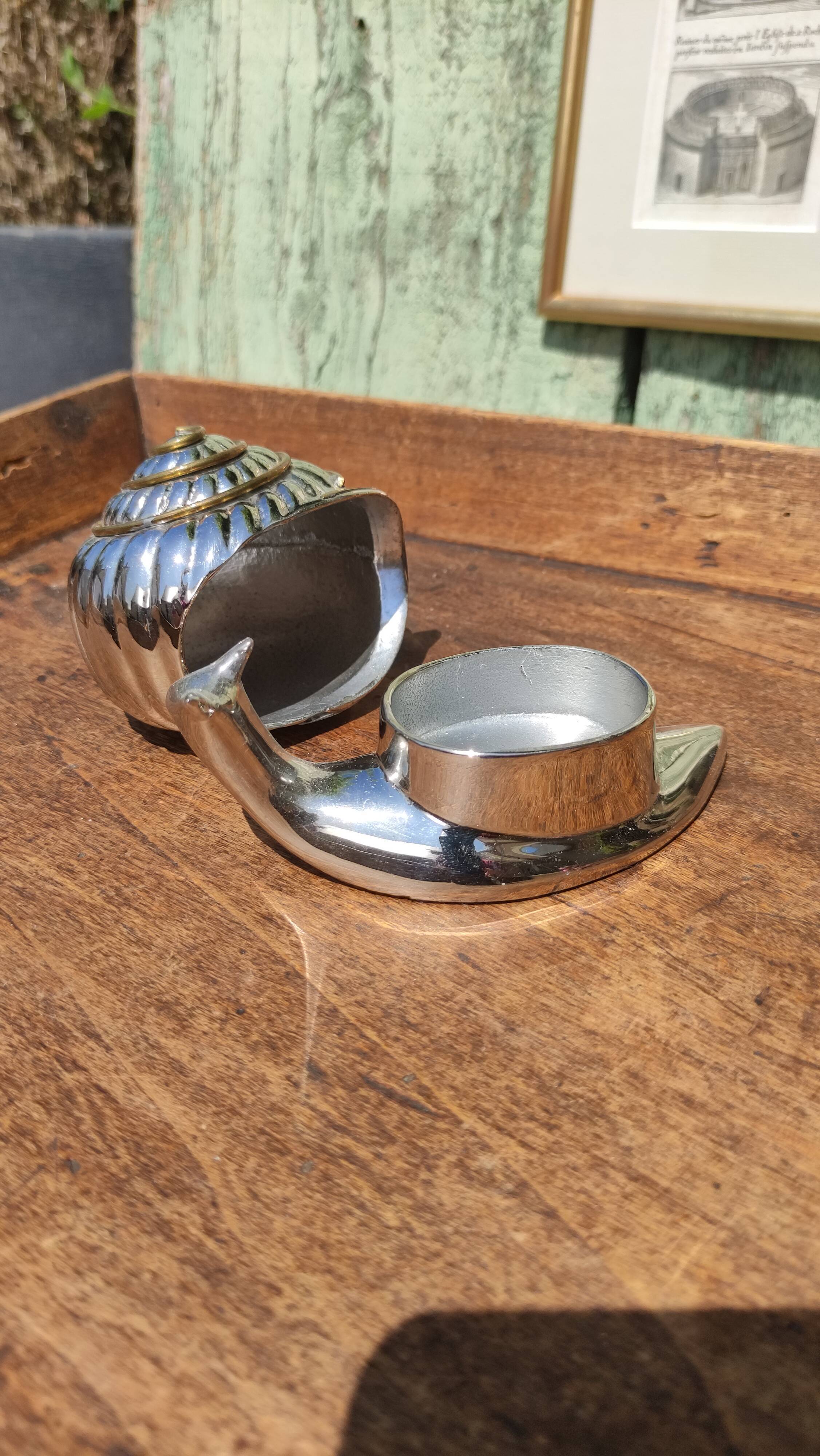 Vintage ashtray in silver and gold metal in the shape of a snail