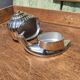 Vintage ashtray in silver and gold metal in the shape of a snail