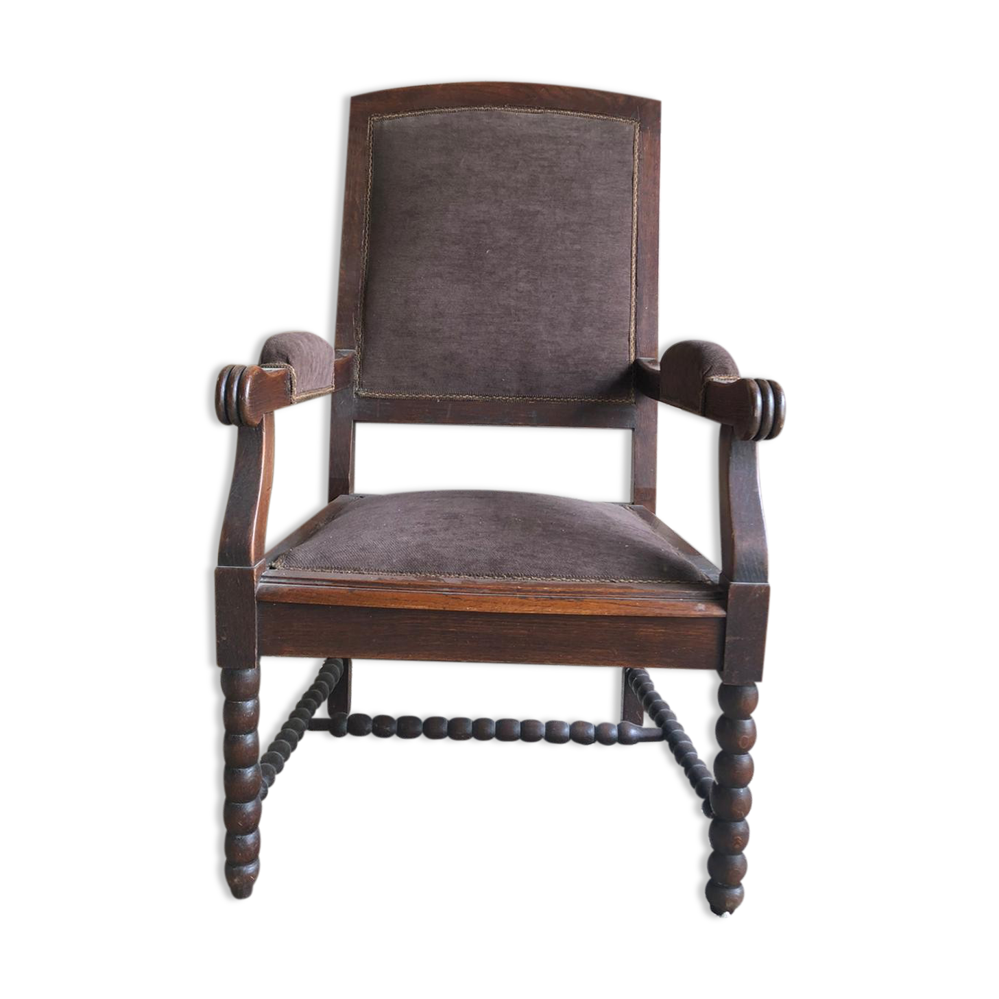 Armchair trimmed with brown fabric