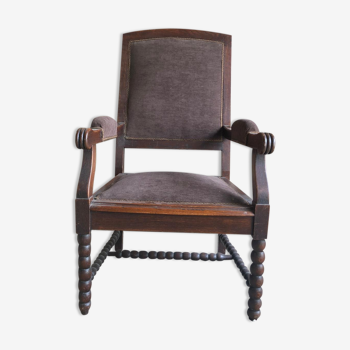 Armchair trimmed with brown fabric