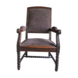 Armchair trimmed with brown fabric
