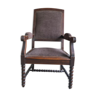Armchair trimmed with brown fabric