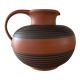 Vintage jug in chiseled terracotta