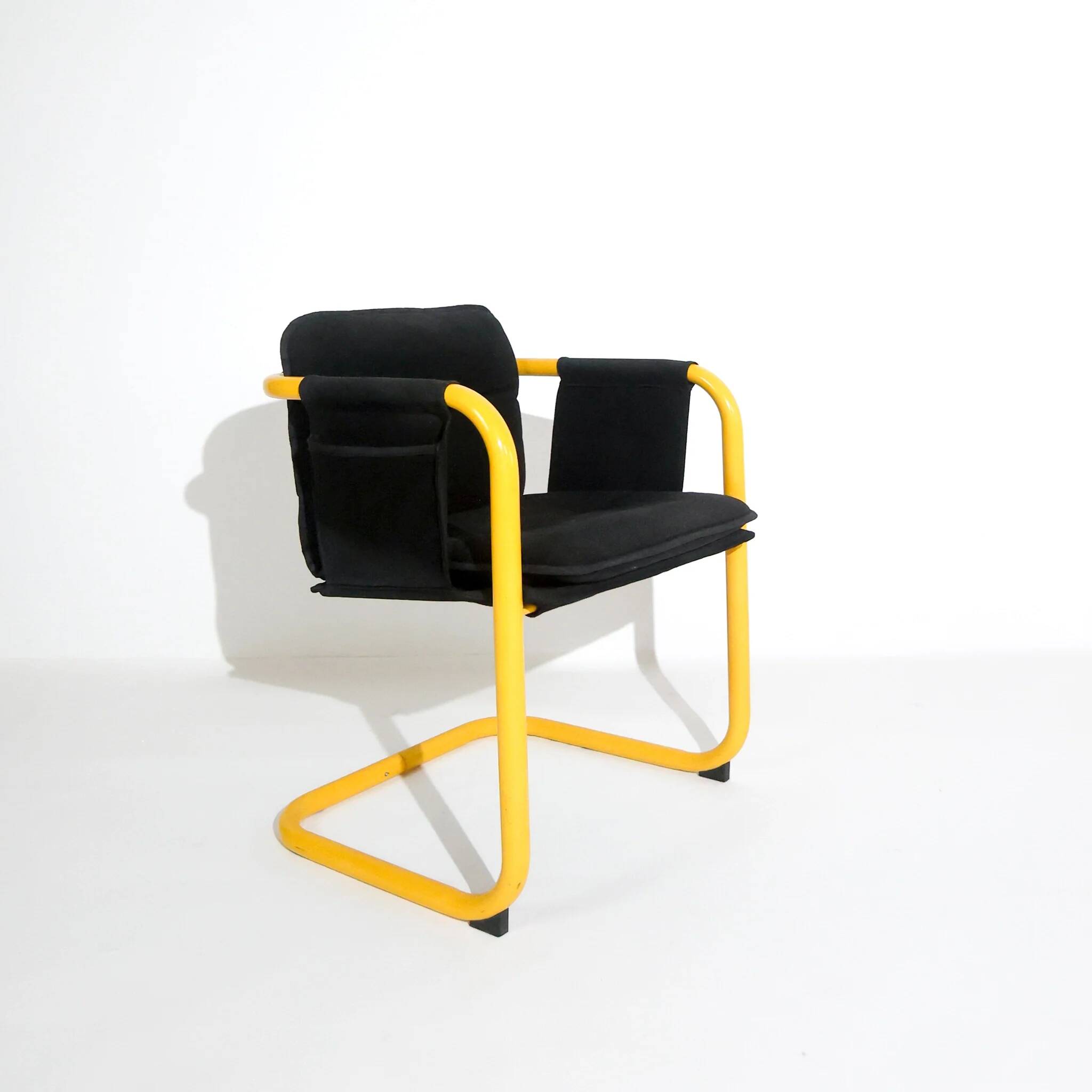 Postmodern cantilever armchair with a yellow tubular frame, Italy, 1970s.