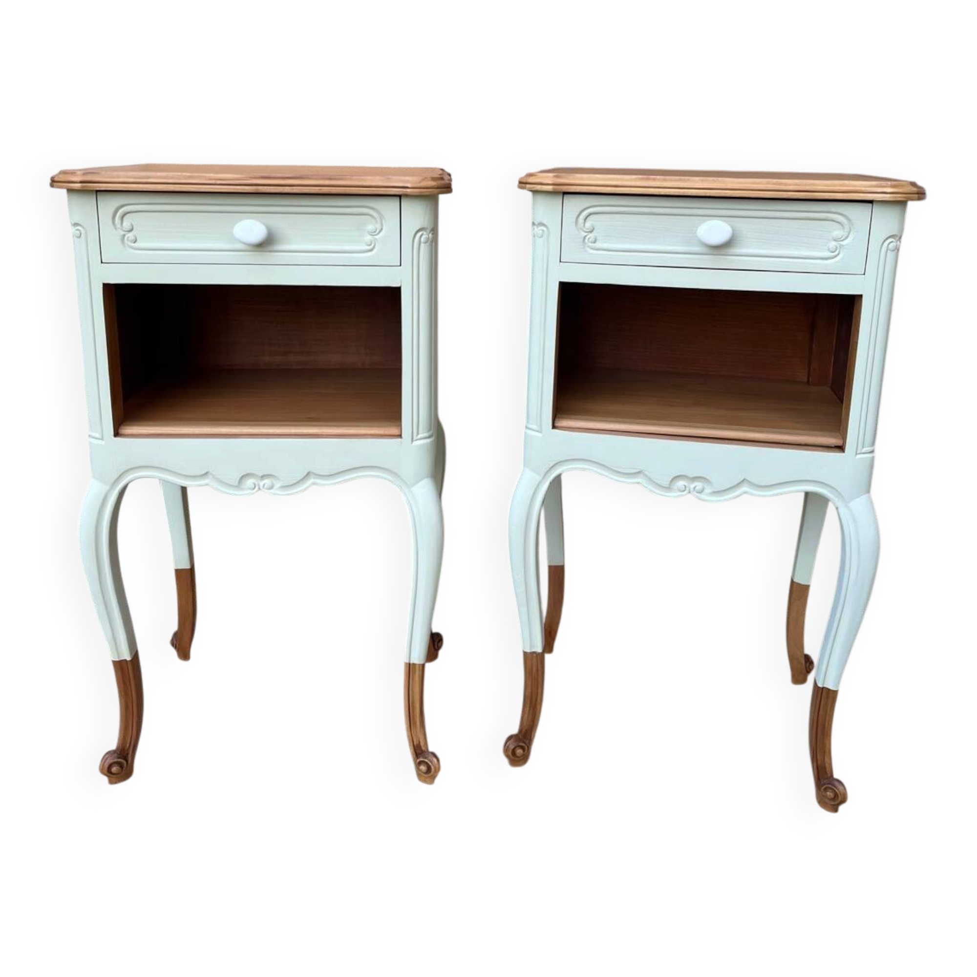 Renovated bedside tables in laurel green and light wood.