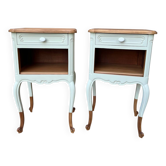Renovated bedside tables in laurel green and light wood.