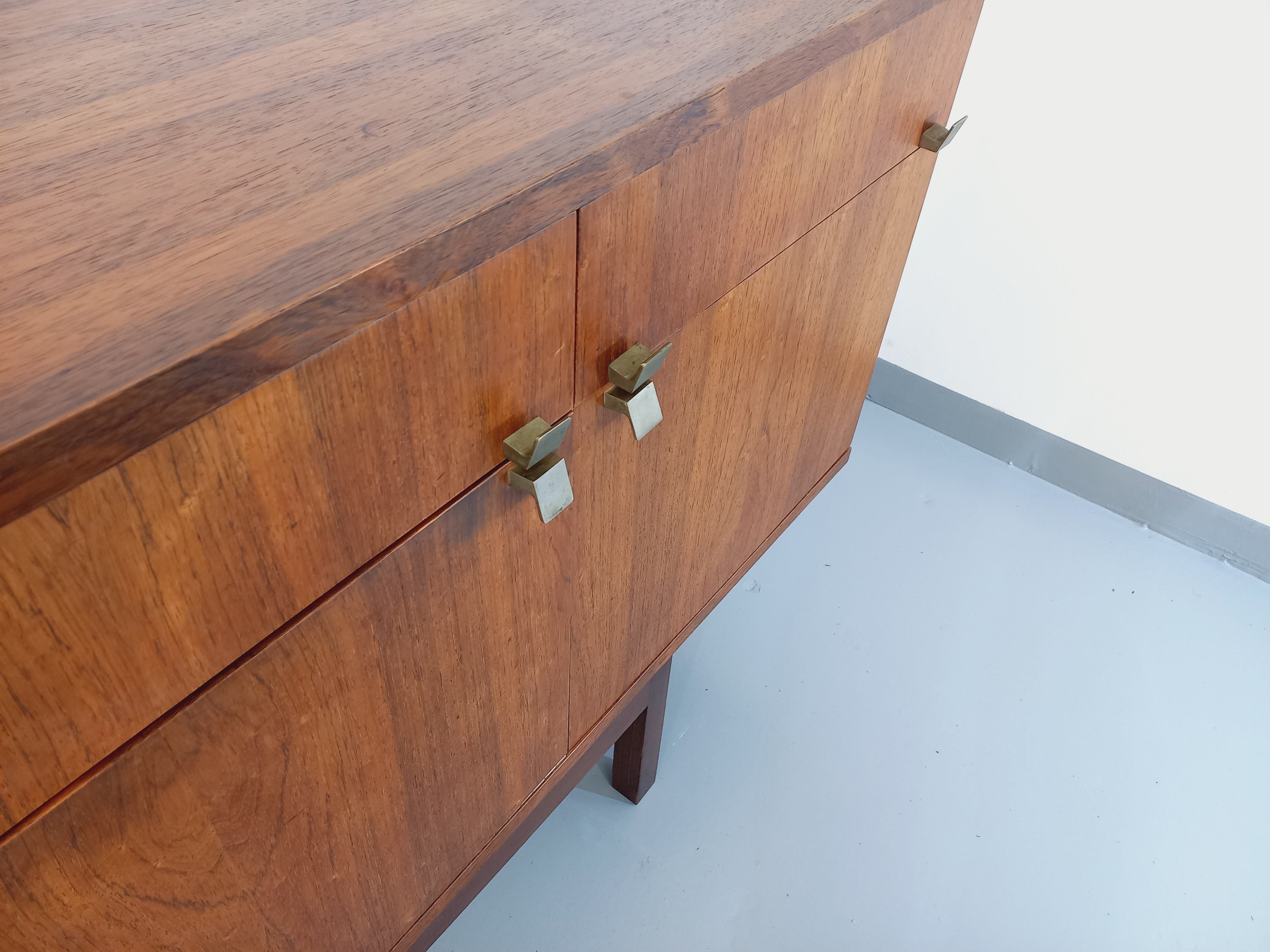 Vintage Scandinavian style row in rosewood and brass from the 60s