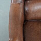 Cognac brown cow leather armchair with decorative nail finish