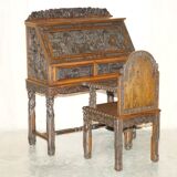 Chinese hand-carved desk from around 1940 with matching chair.