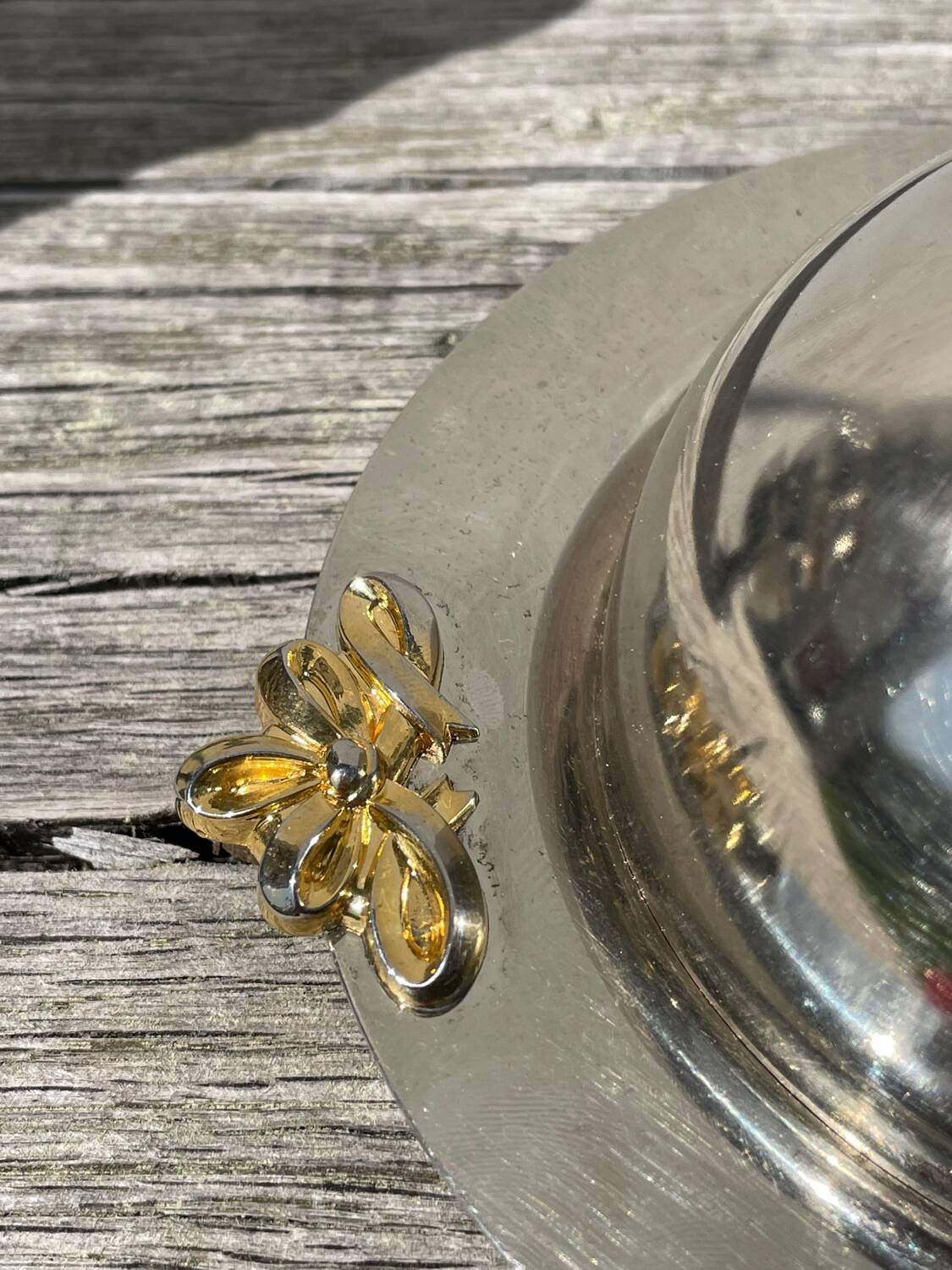 Silver-plated metal butter dish with knots