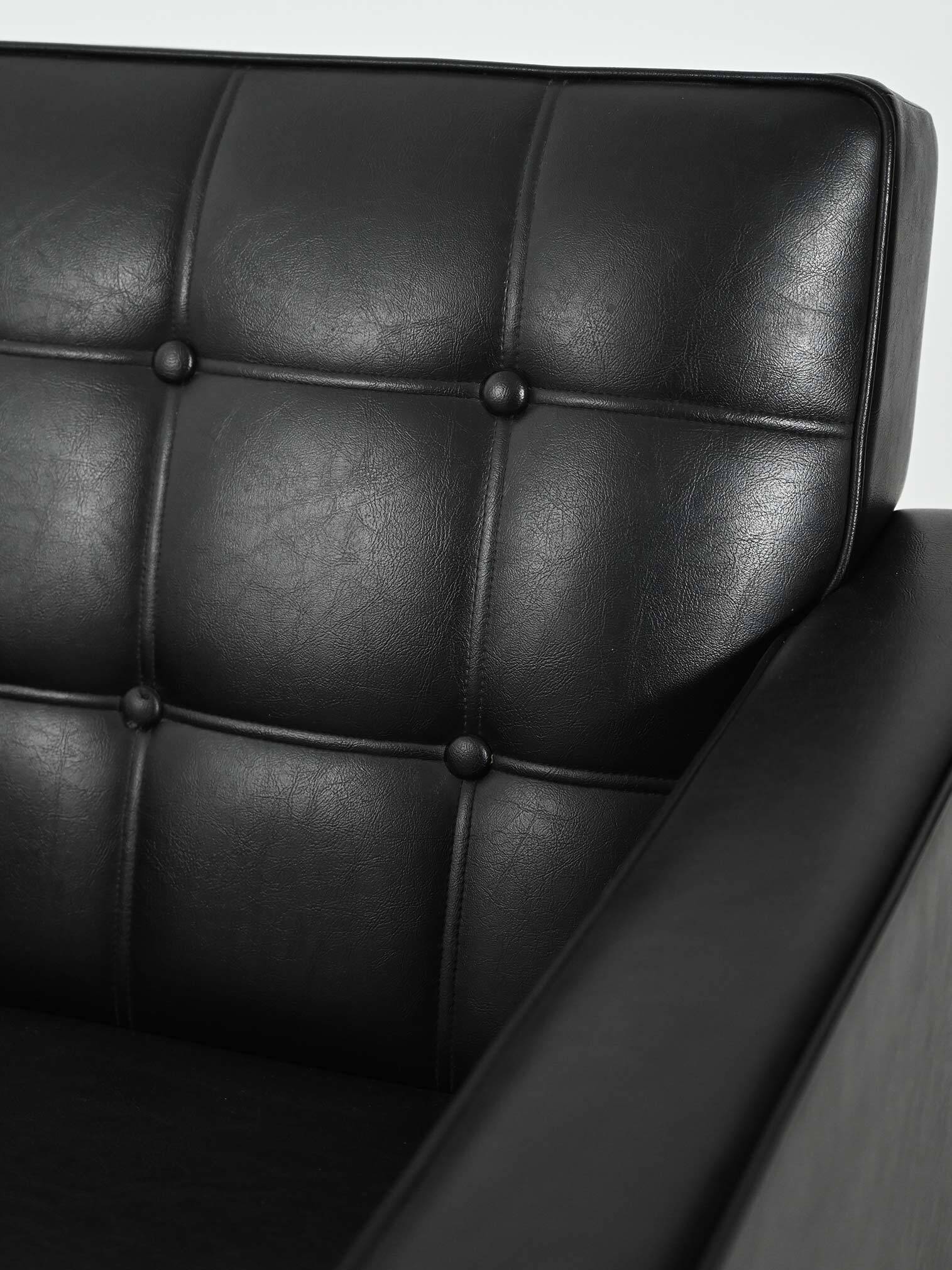 Swedish AB Futura teak and faux leather armchair