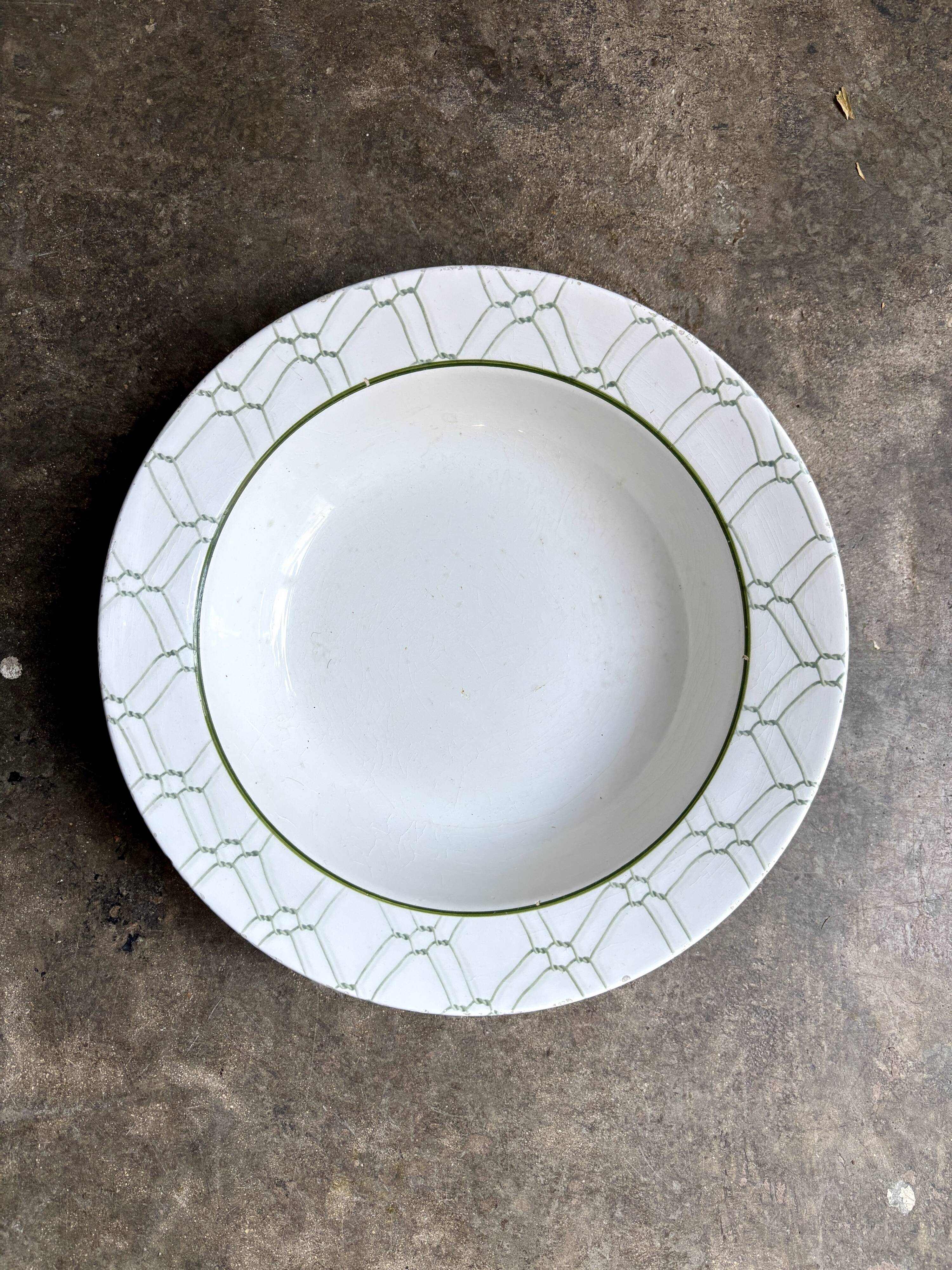 Small round hollow dish by Christian Dior in Italian earthenware