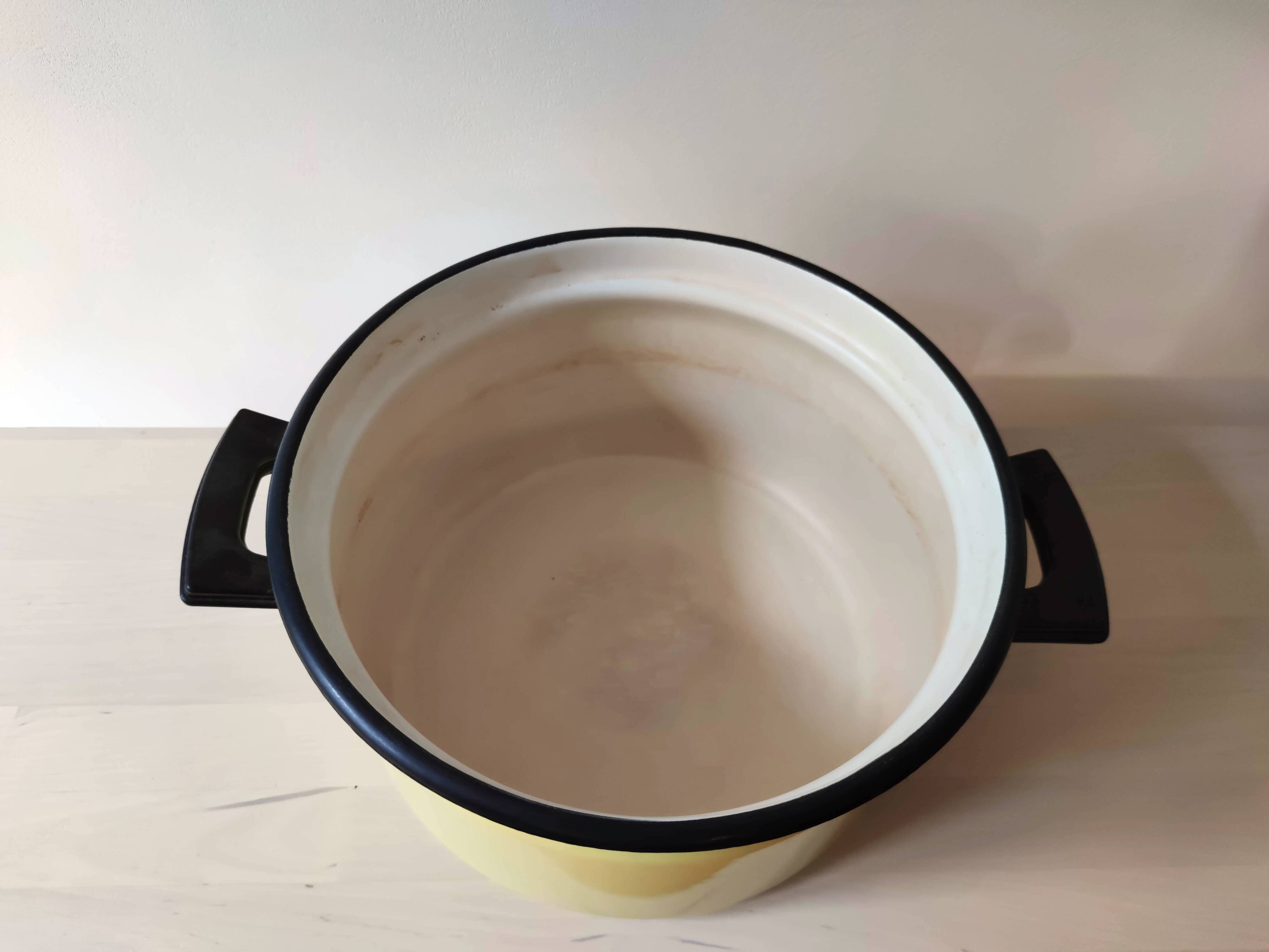 Bright yellow enameled metal stewpot - aubecq from the 1950s