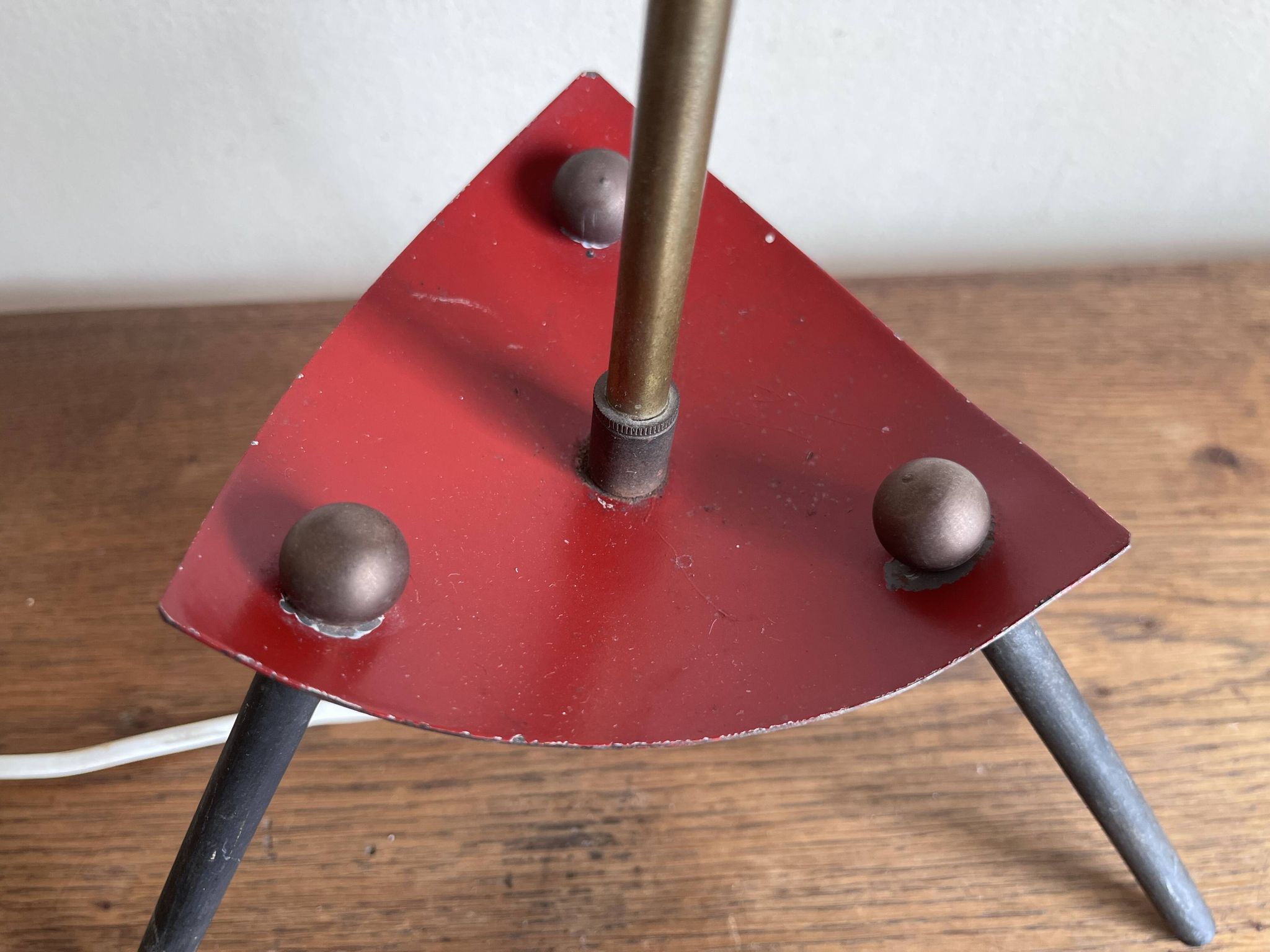 1950s modernist tripod lamp made of sheet metal and brass.