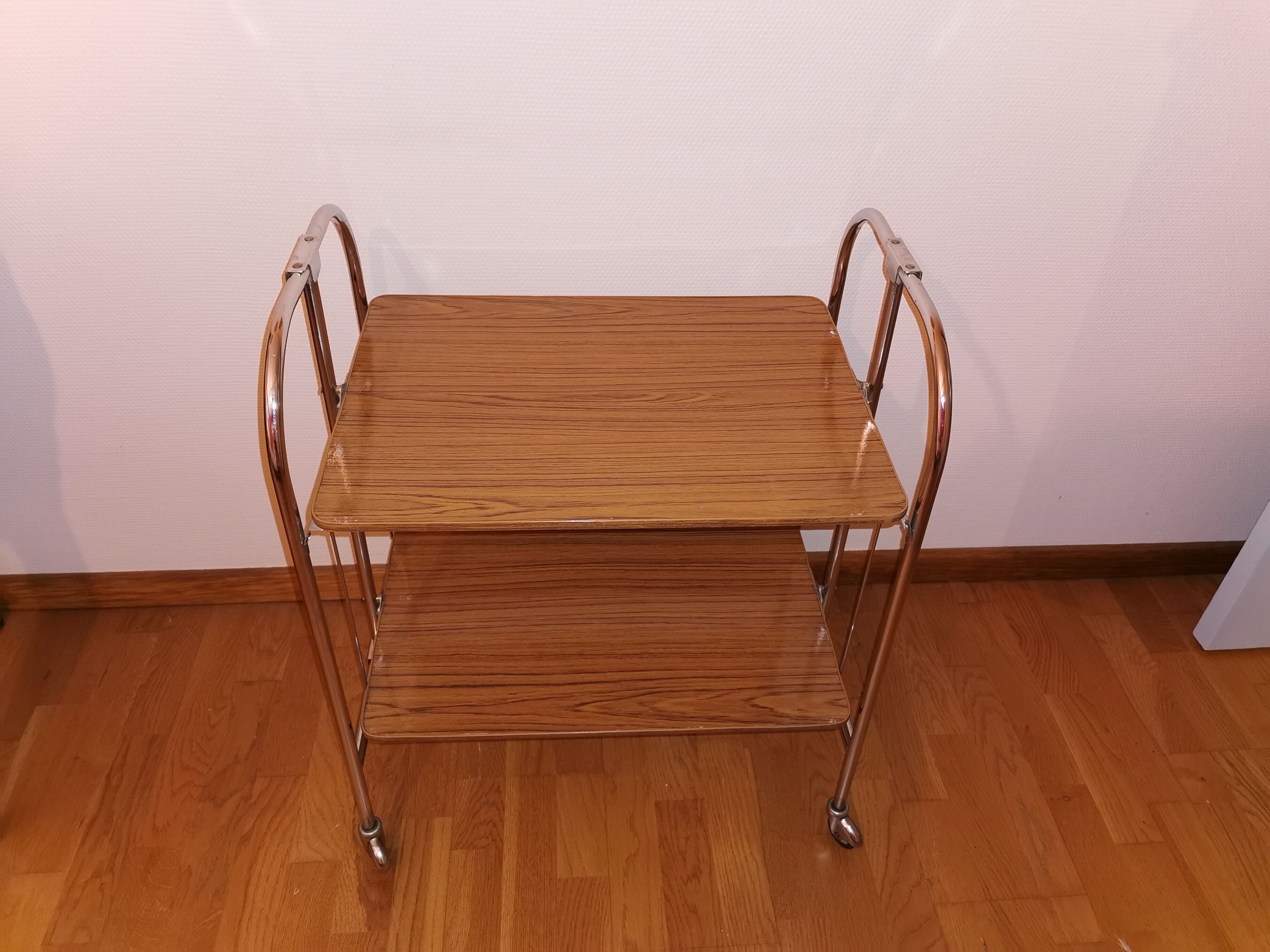 Vintage rolling and folding dessert trolley in chrome metal.