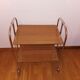 Vintage rolling and folding dessert trolley in chrome metal.