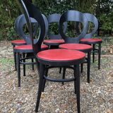 6 vintage Baumann seagull model chairs, black lacquered with red Skai seats.
