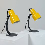 A pair of well-designed minimalist bedside lamps.