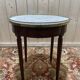 Table bouillotte de style Louis XVI en acajou et marbre.