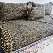 Moroccan sofa on the floor – black and gold pattern