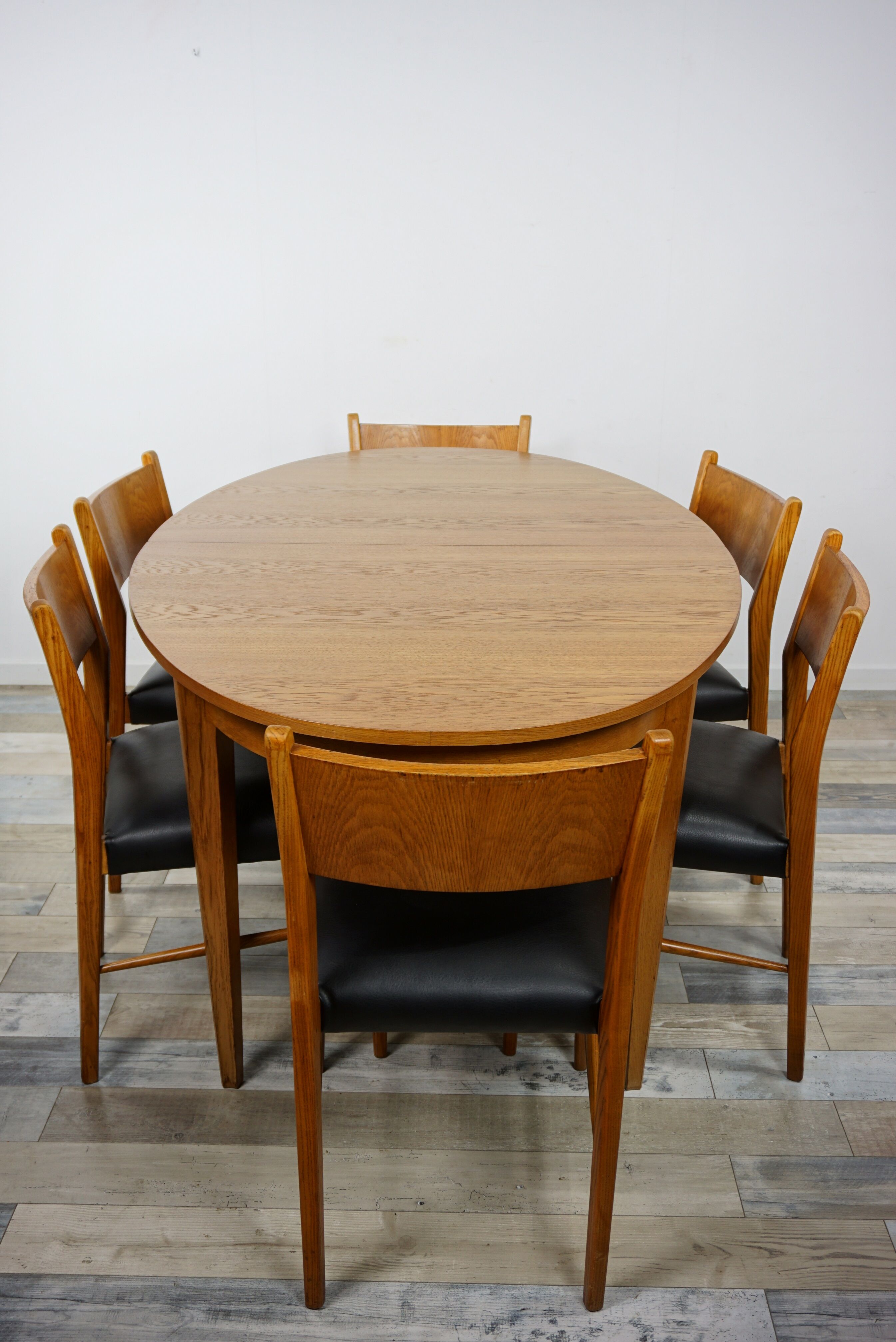 Wooden oval table and 6 matching chairs 60