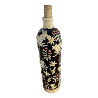 Vintage 1950s ceramic bottle with reliefs.