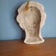 Antique plaster face of a woman