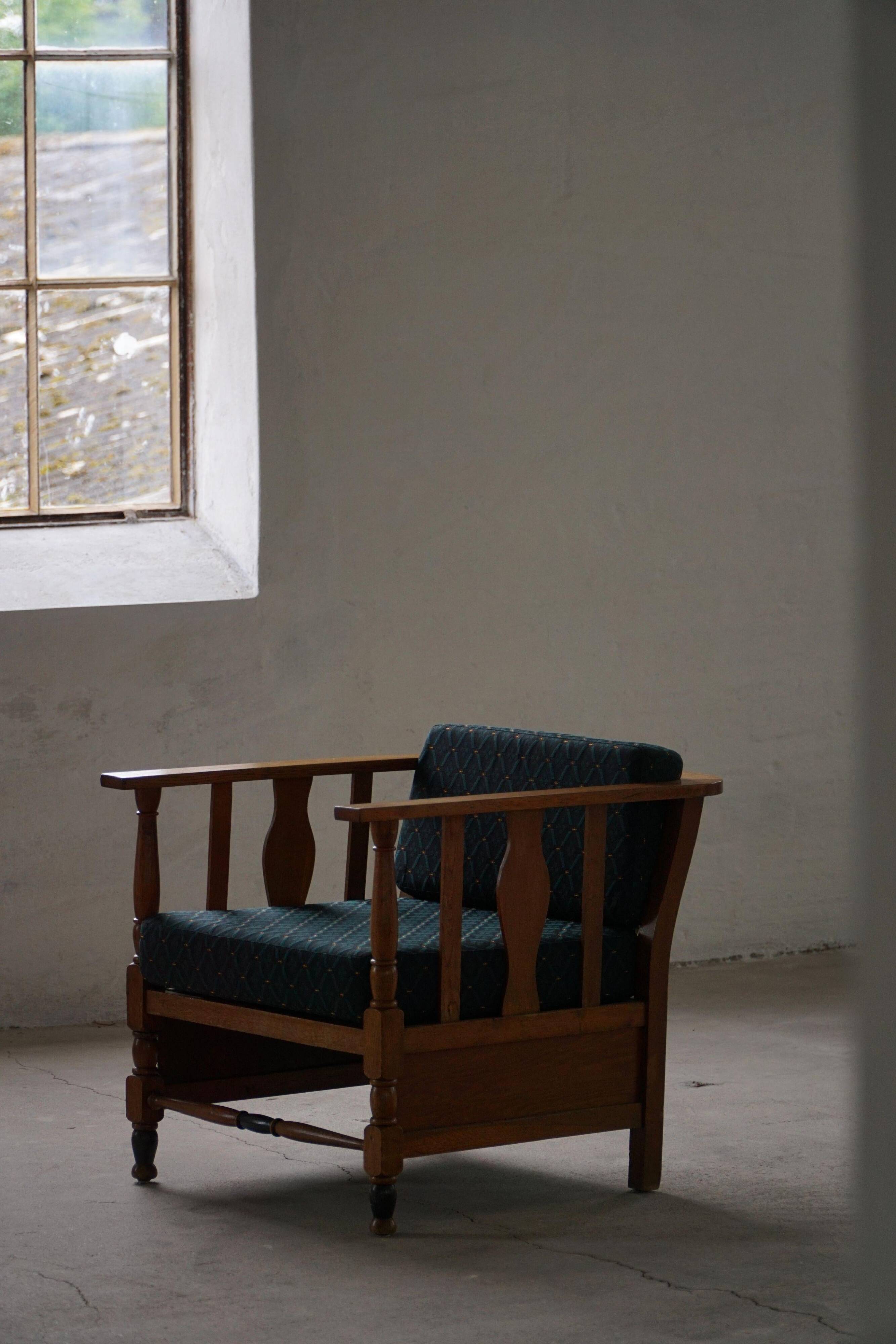 Art Nouveau, pair of oak lounge chairs, reupholstered in style fabric, 1920s.