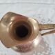 Chiseled brass pitcher decorated foliage