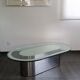 Vintage coffee table with glass and chrome metal.