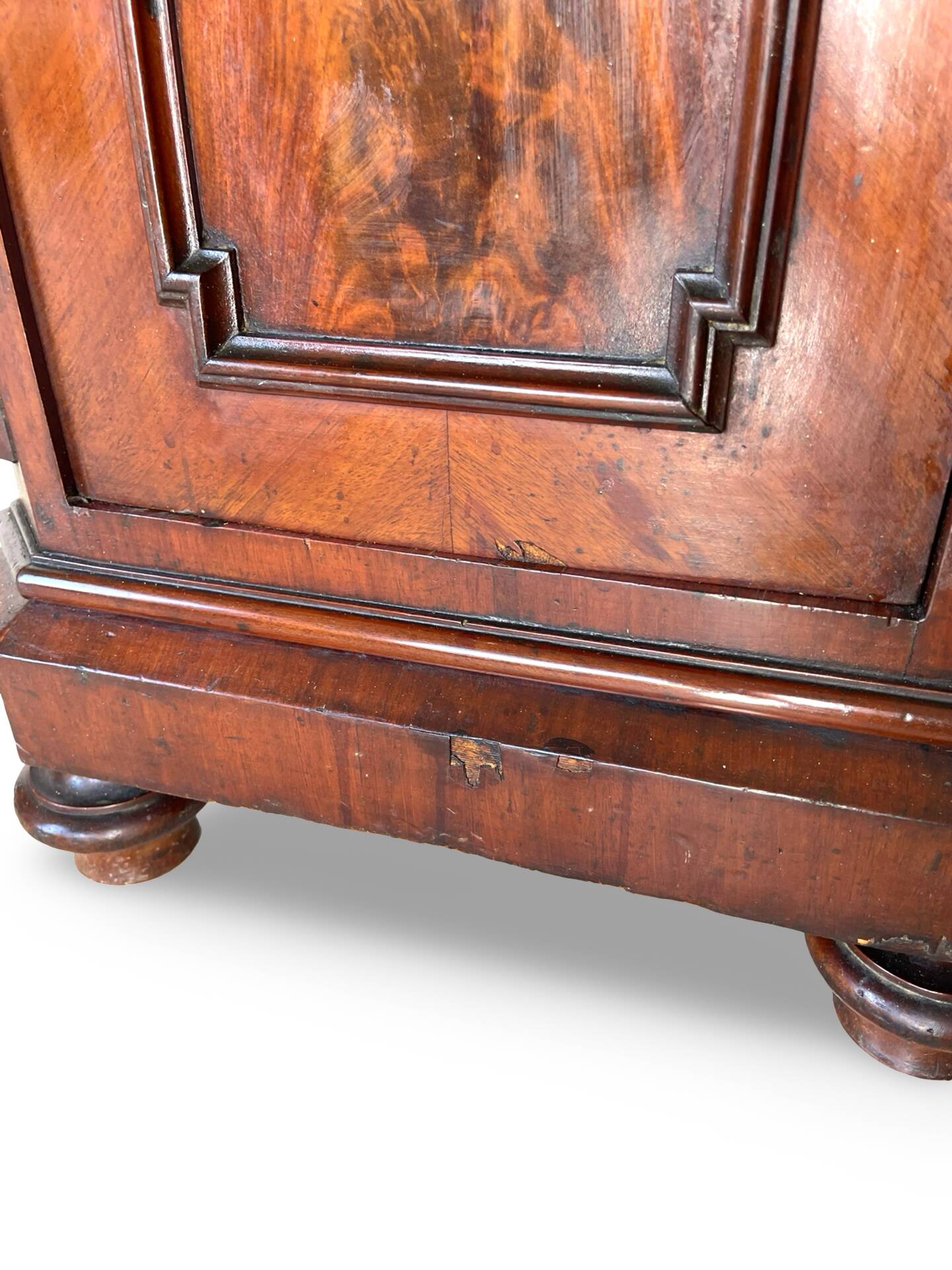 A pair of antique walnut bedside tables from the 1890s.