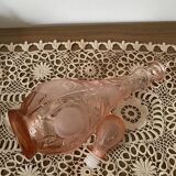 Pink glass carafe with frosted and embossed fruit patterns.