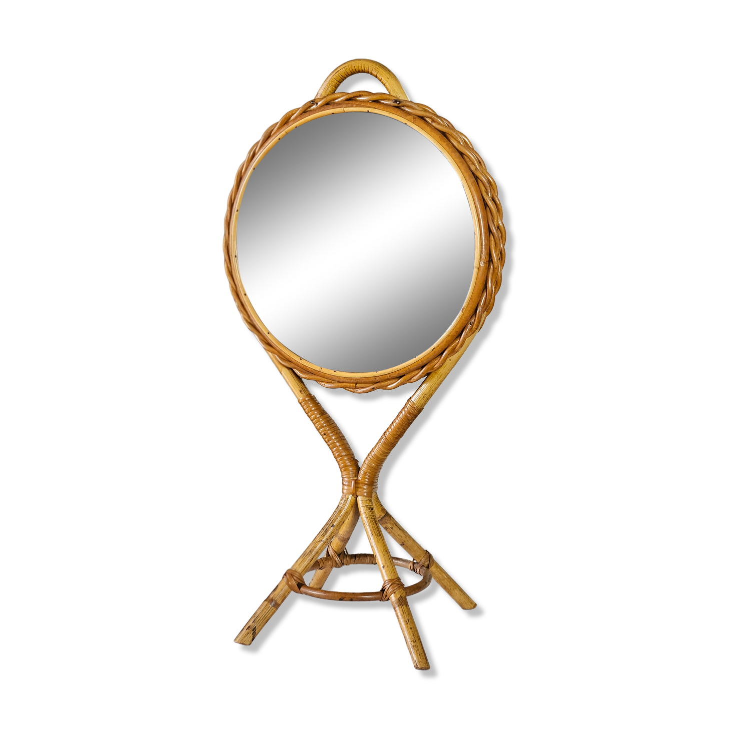 Vintage double-sided round mirror on a rattan stand.