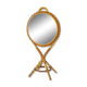 Vintage double-sided round mirror on a rattan stand.