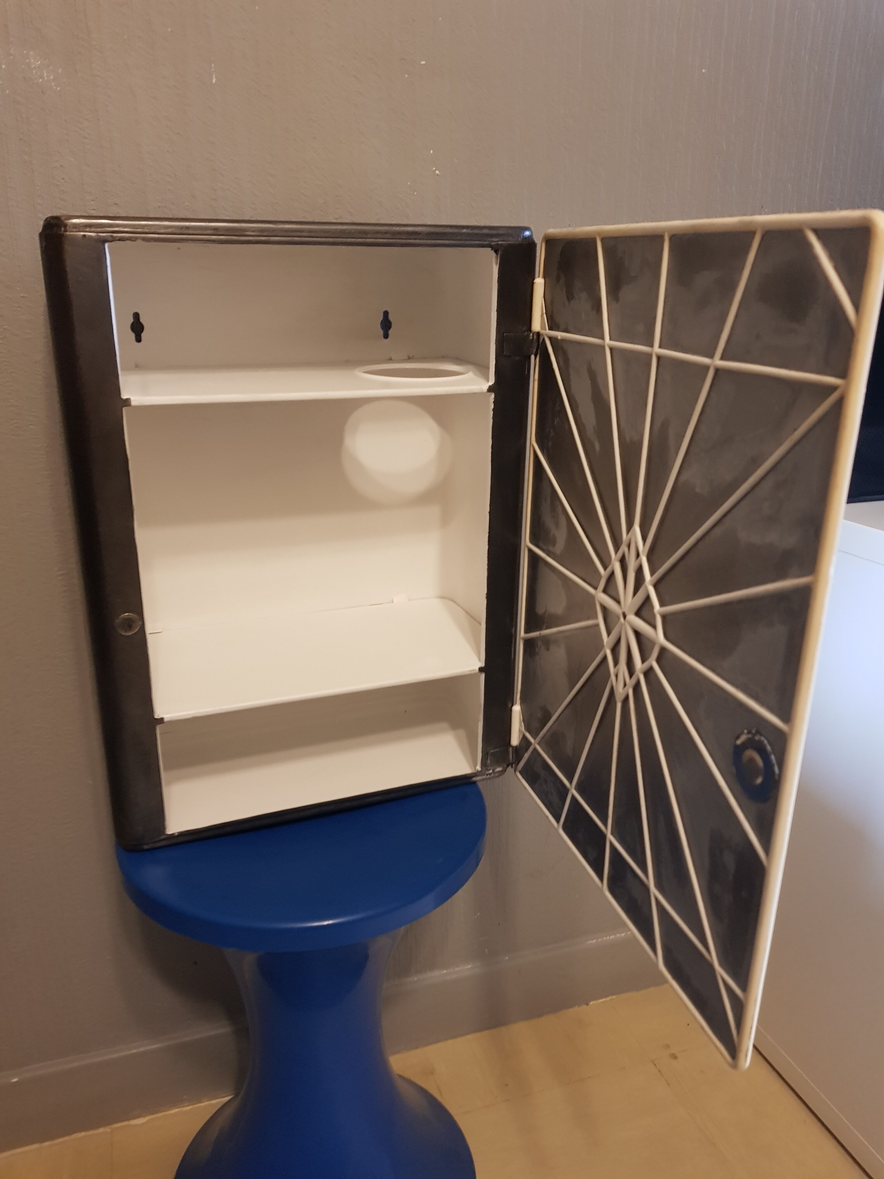 Vintage wax metal medicine cabinet.