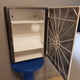 Vintage wax metal medicine cabinet.