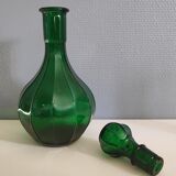 Old green carafe with ribbed lines