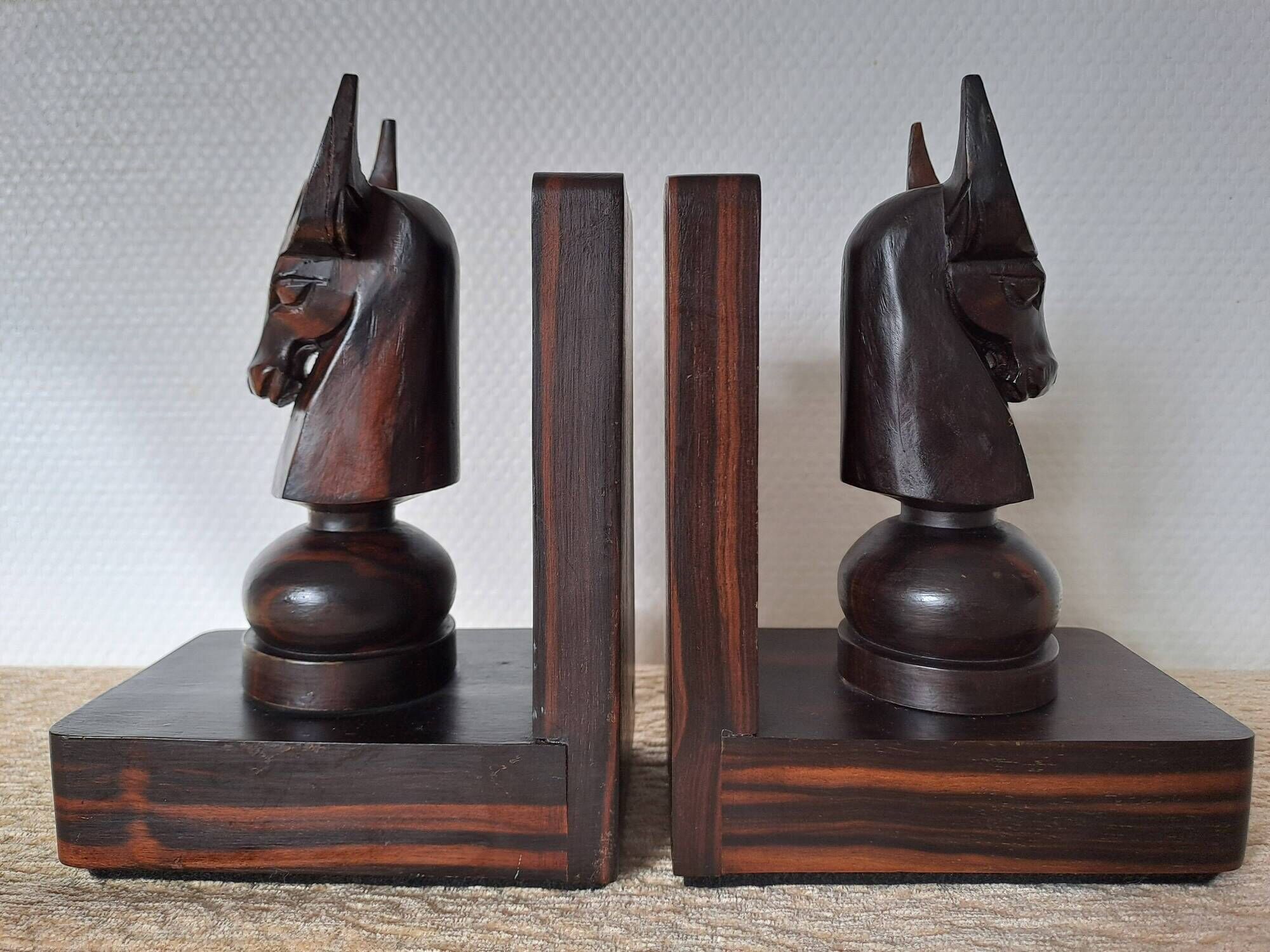 Pair of vintage wooden bookends with stylised horse heads.