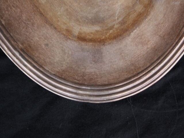 Flat oval silver metal