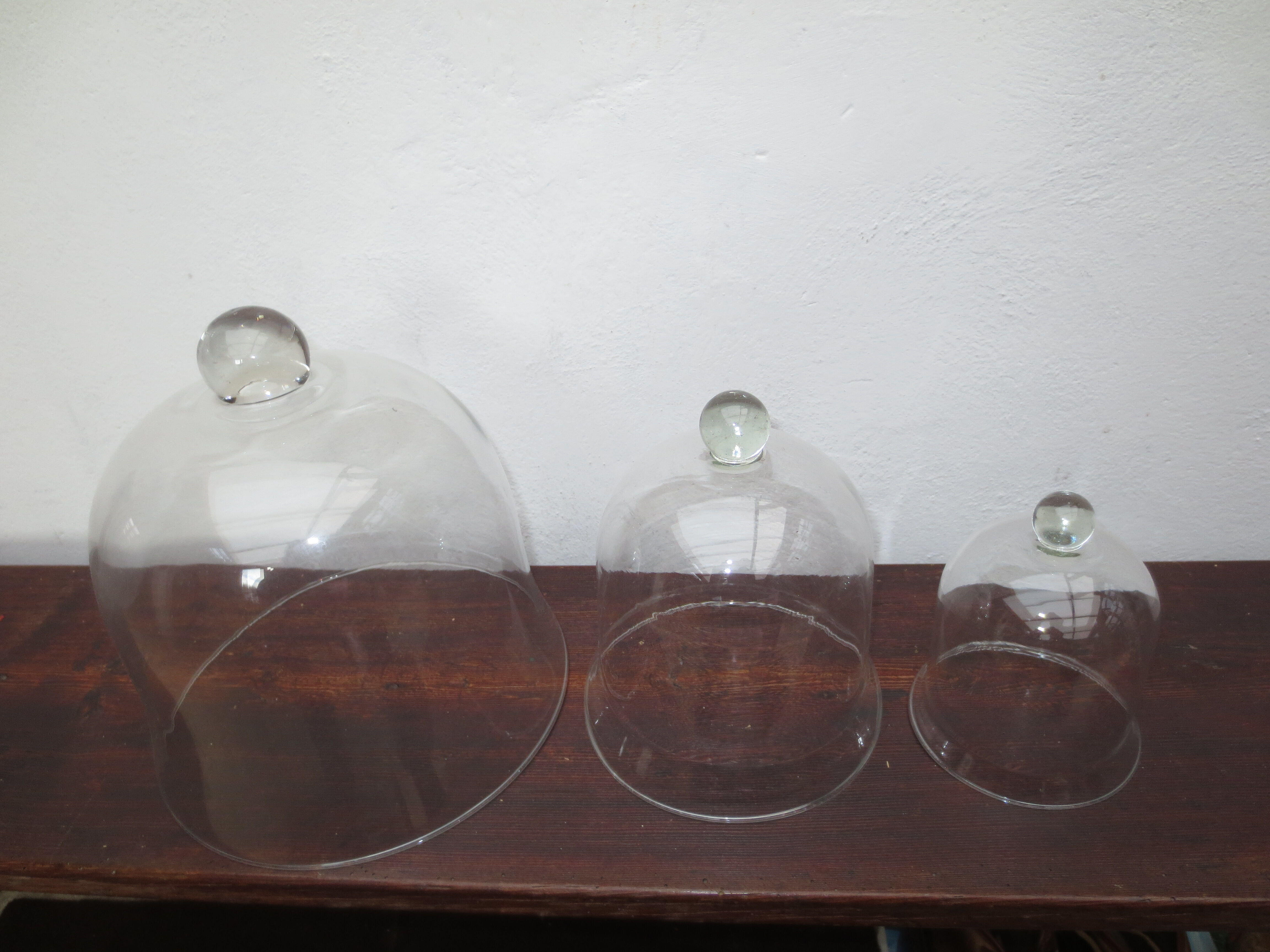 trio of old bells in transparent glass