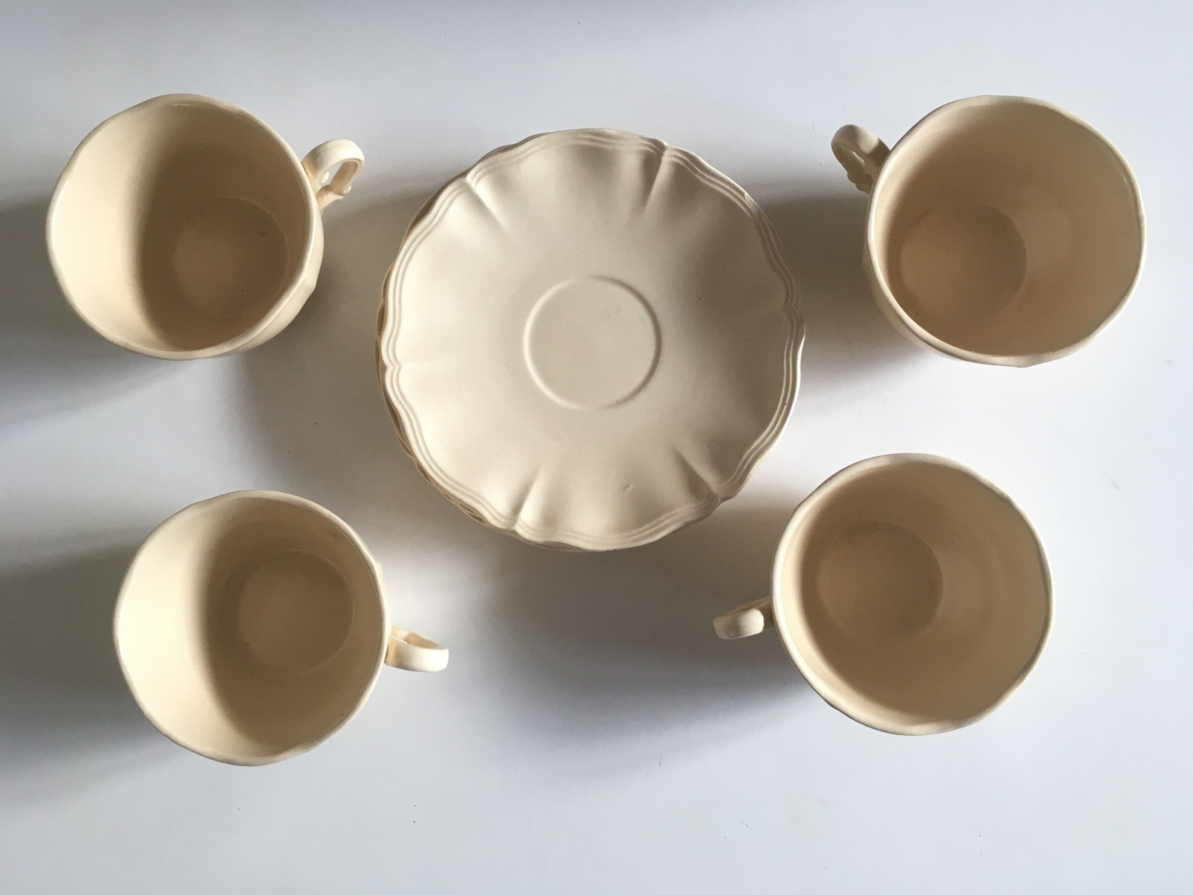 4 cups set in ivory faience from Sarreguemines to godrons