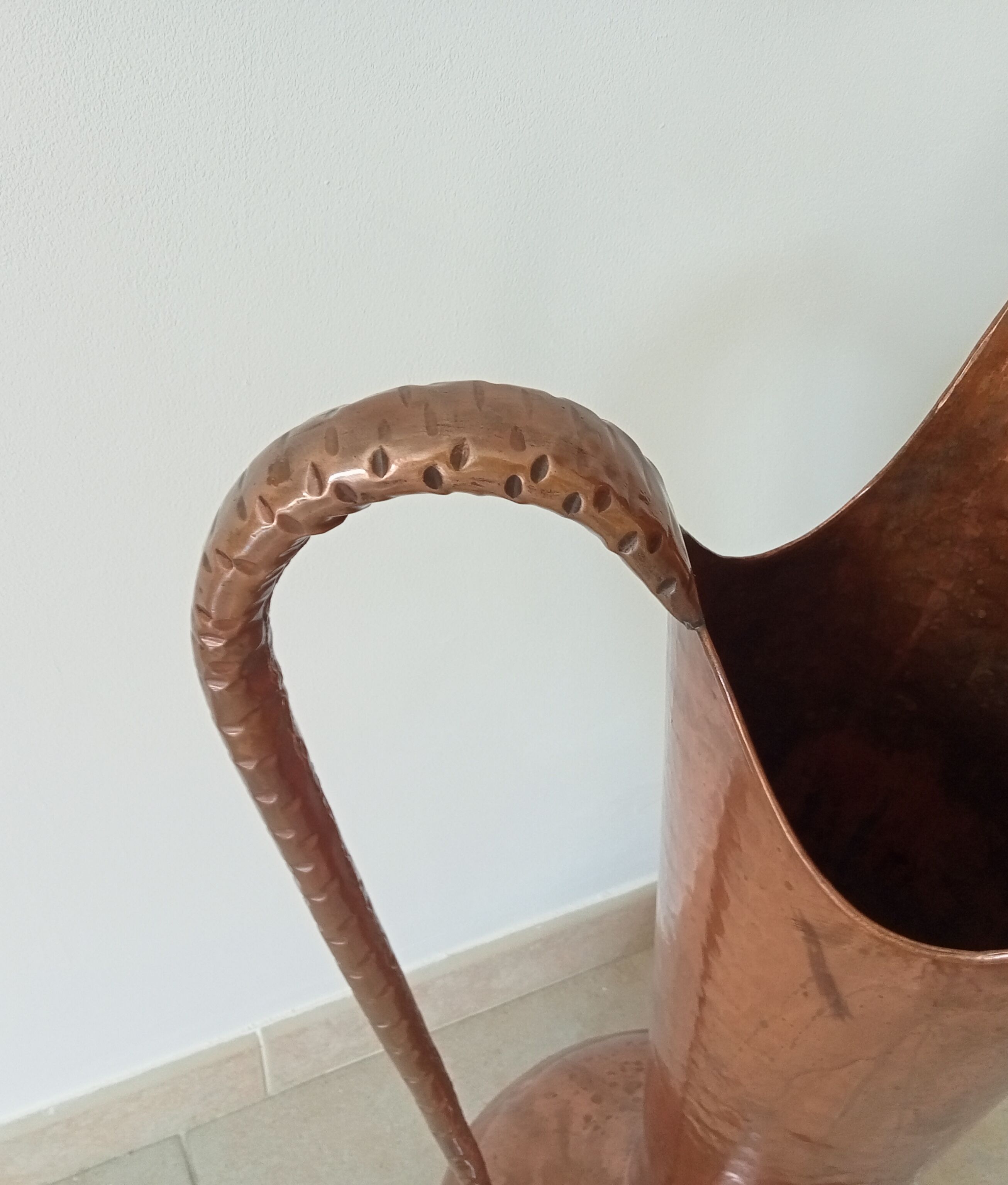 Old italian amphora vase in hammered copper