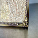 Metal vintage frame in gold colored brass