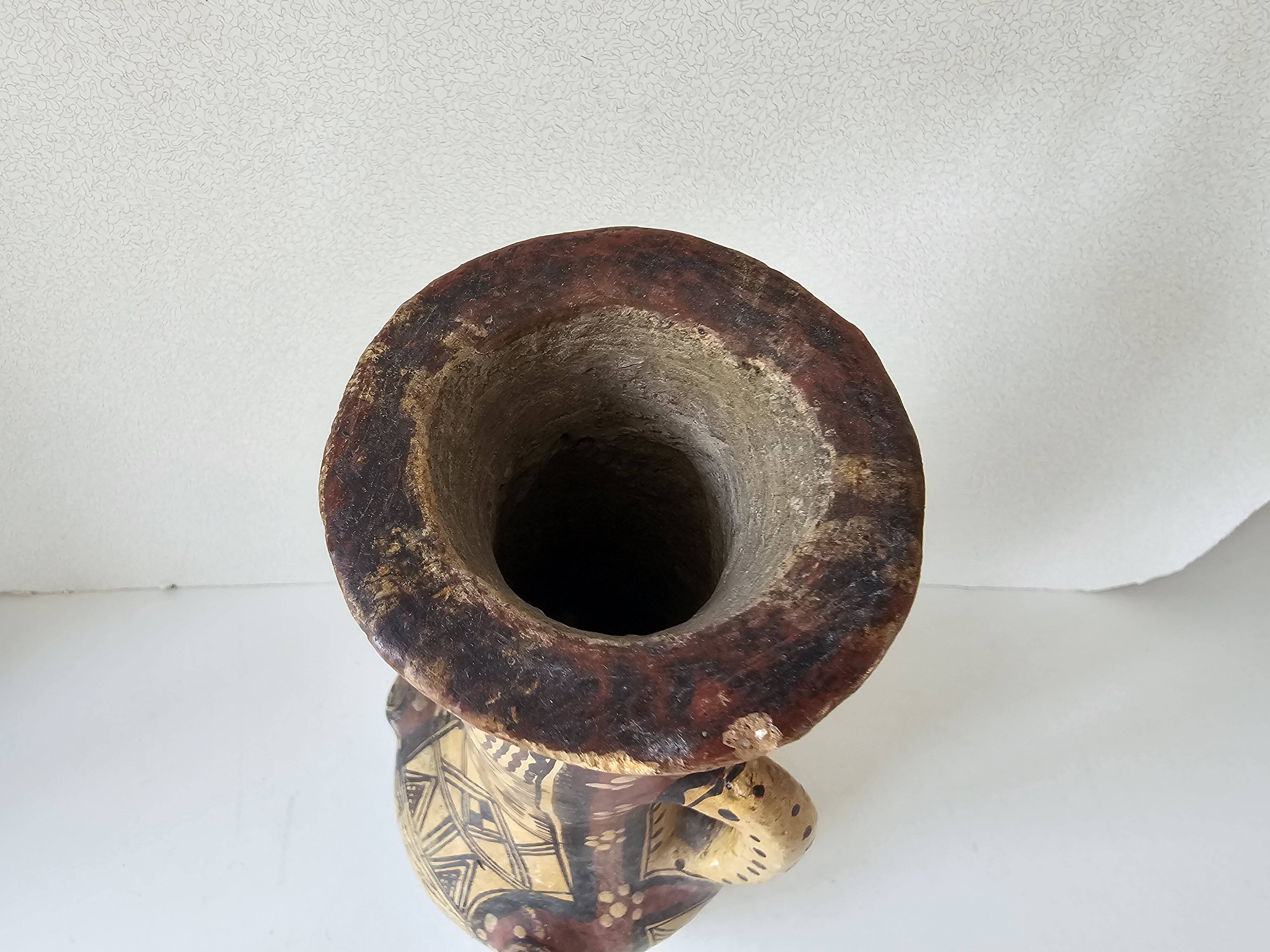 Antique Kabyle Algerian pottery vase with handle and polychrome geometric decorations