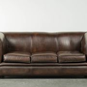 Set of a smooth chesterfield sofa and armchair with a timeless English look