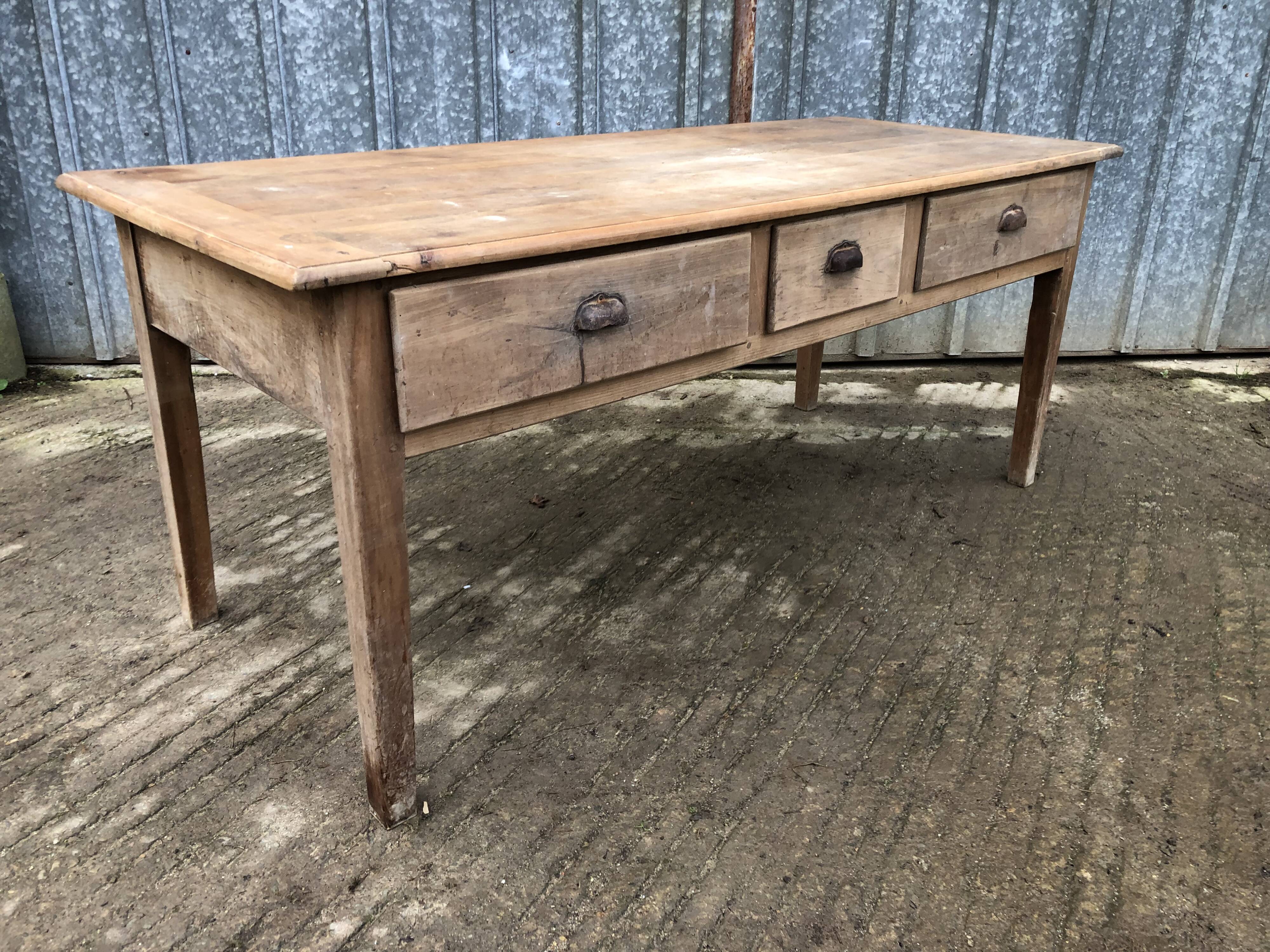 Antique solid cherry farm table with 3 front drawers.