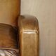 Three-seater Art Deco style leather sofa with feather cushions.