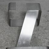 Coffee table with "kinetic" steel base and glass slab. Circa 1970.